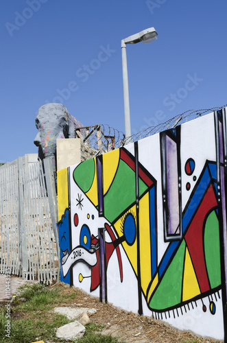 IMIZAMO YETHU TOWNSHIP WESTERN CAPE SOUTH AFRICA . A general view of the Imizamo Yethu township at Hout Bay and the newly painted walls of the exterior fence photo