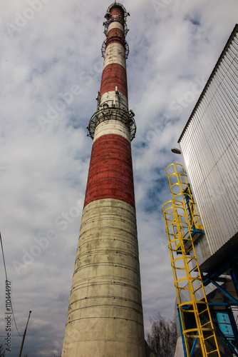 white and red high concrete chimney