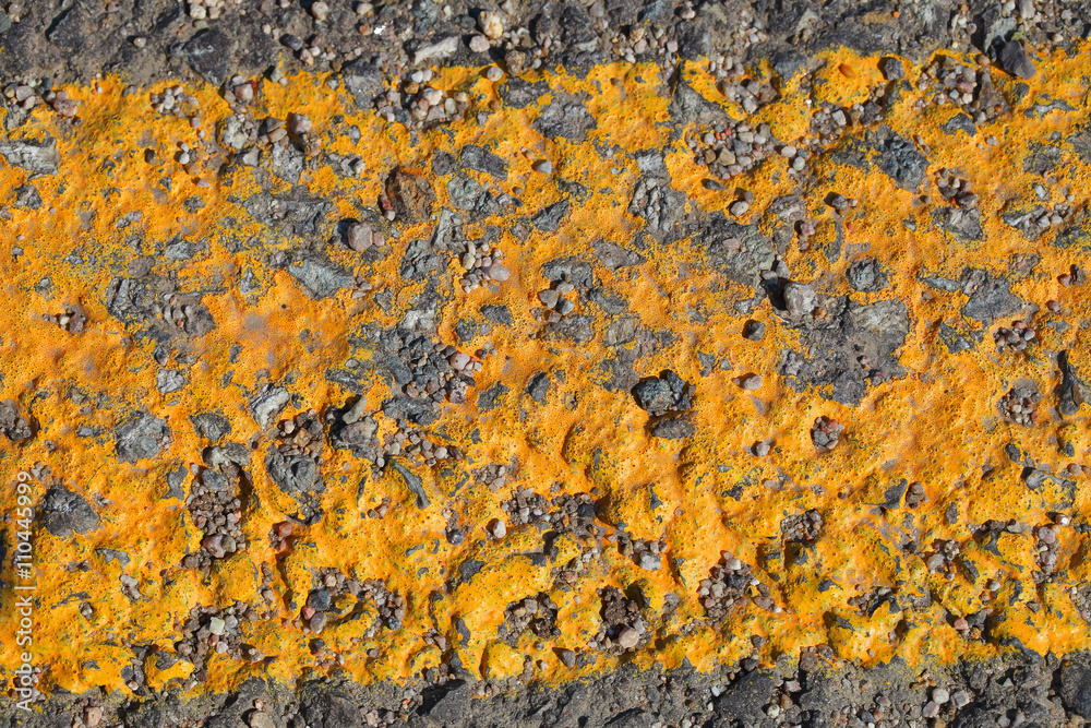 Yellow worn markings on asphalt road Yellow worn markings on asphalt road