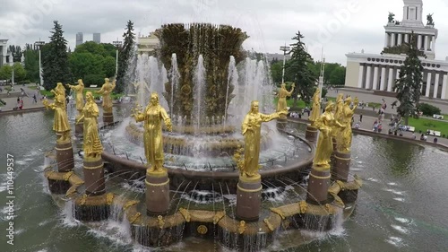 Aerial shot of Friendship of Nations Fountain at All-Russia Exhibition Centre. Golden statues and grand fountain composition. Sightseeing of Moscow photo