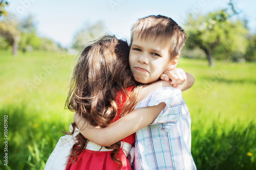 family embrace of brother and sister