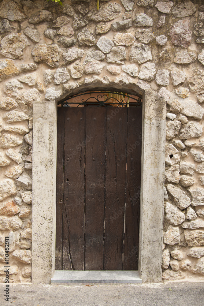 Old door in the ancient stone house