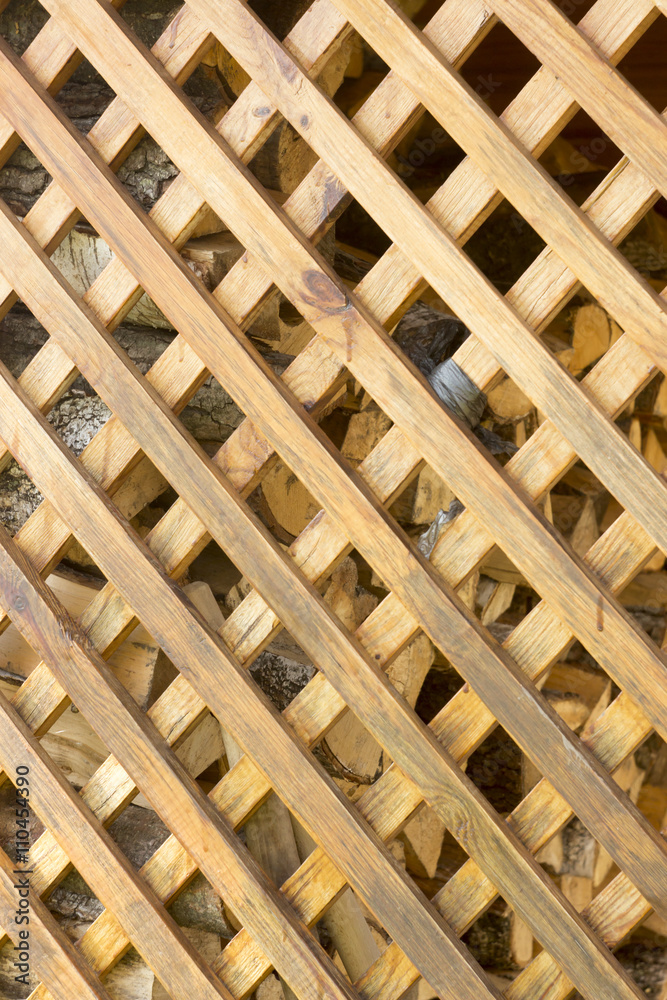 yellow wooden grille with diamond-shaped cells yellow wooden grille with diamond-shaped cells