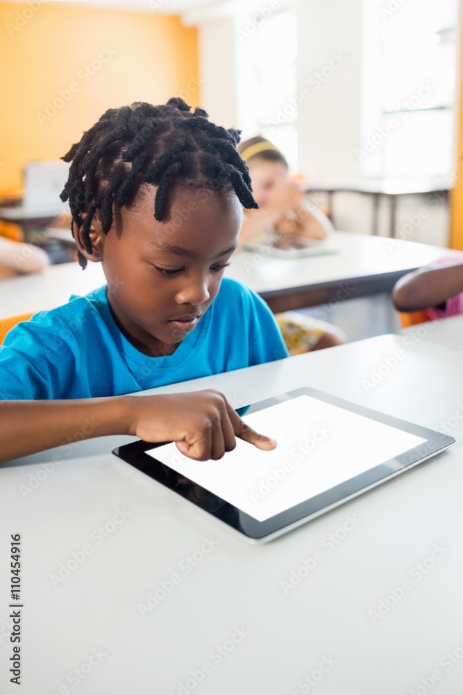 Little boy studying with tablet in classroom Little boy studying with tablet in classroom