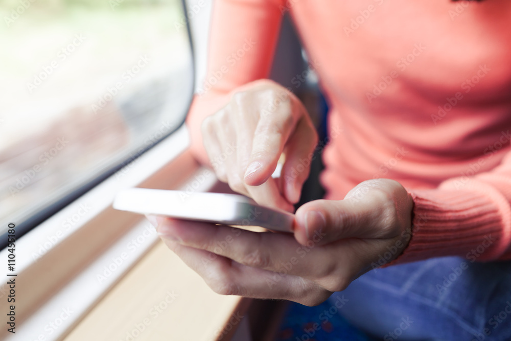 Obraz premium Woman Using a Smart Phone.