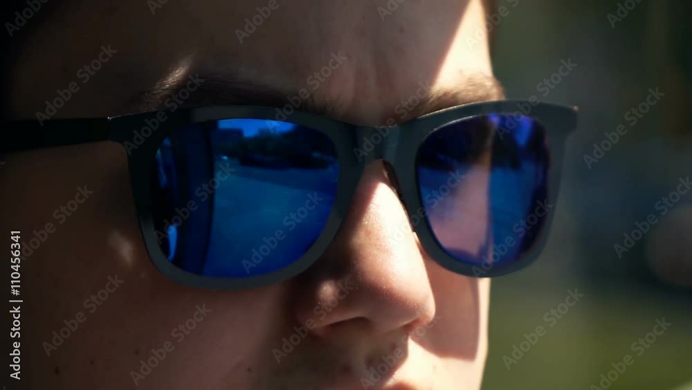 Close up of young boy wearing sunglasses during tram ride, super slow motion 240fps
Close up of young boy wearing sunglasses during tram ride, super slow motion 240fps