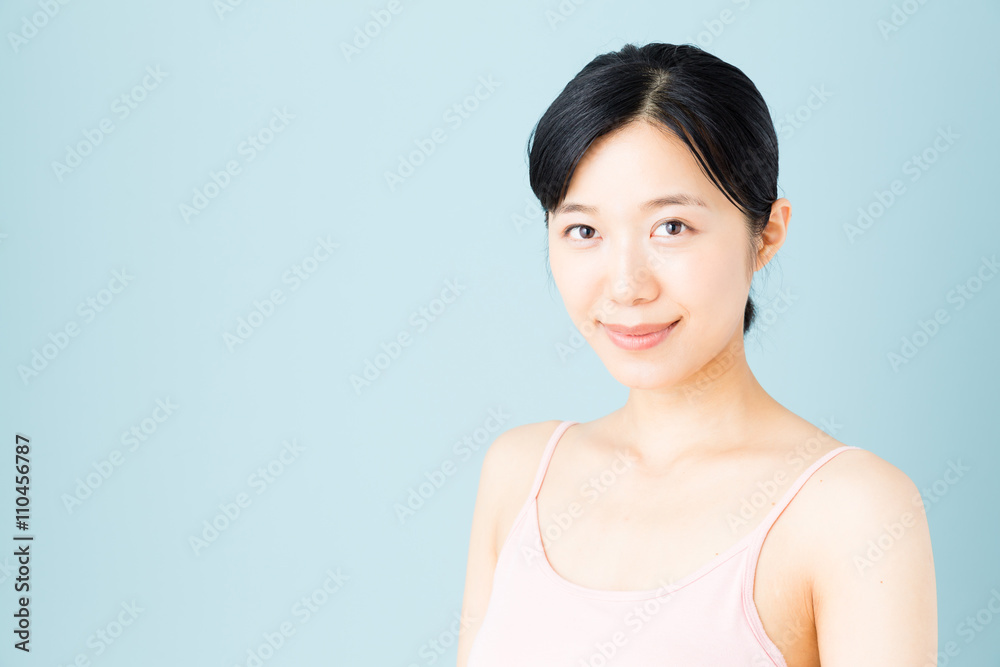 attractive asian woman skincare image on blue background attractive asian woman skincare image on blue background