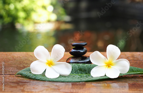 Spa massage with flower and rock spa on the leaves, Thailand 