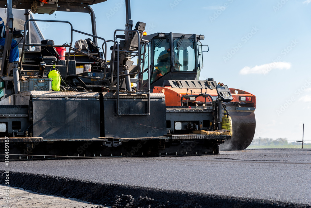 Road roller working on the construction site Road roller working on the construction site