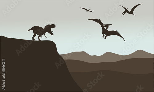 Silhouette of pterodactyl and tyrannosaurus