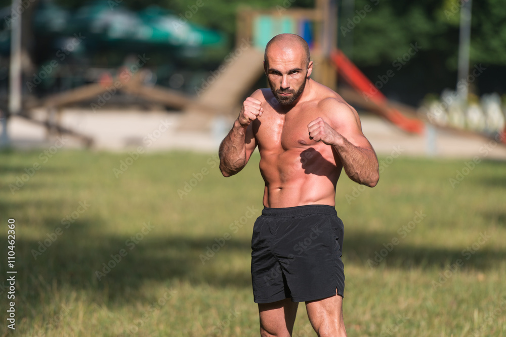 Adult Man Boxing Workout Outdoors In Park Adult Man Boxing Workout Outdoors In Park