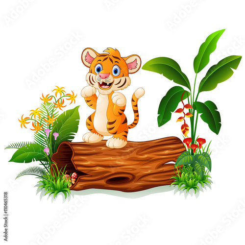 Fototapeta Naklejka Na Ścianę i Meble -  Cartoon baby tiger on tree trunk