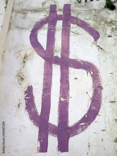 Dollar sign on wall