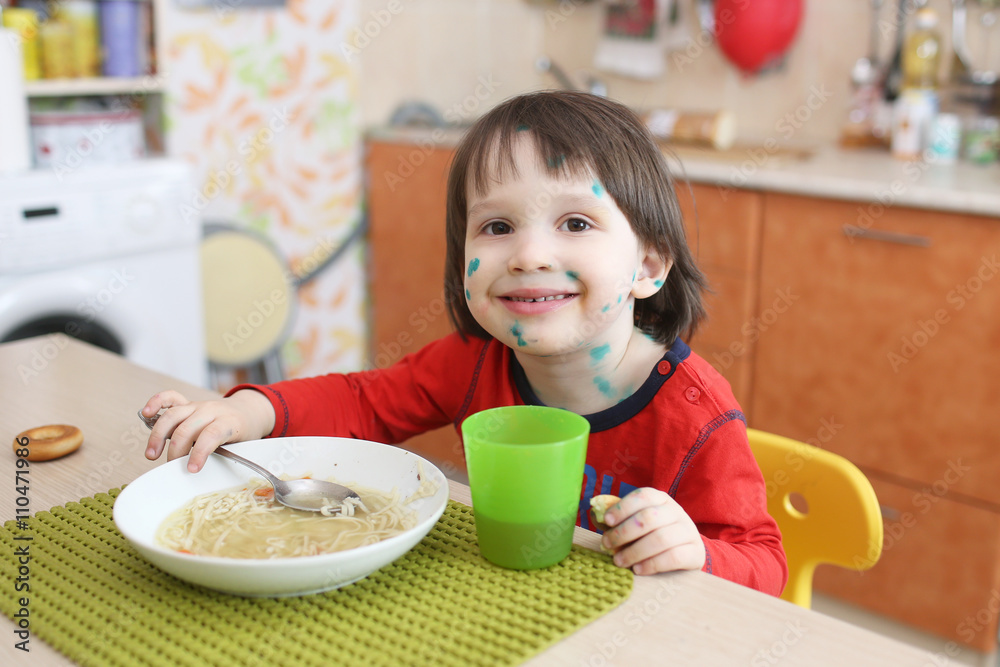 Portrait of happy child with chicken pox eats soup Portrait of happy child with chicken pox eats soup
