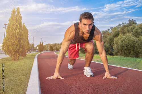 Handsome Athletic Man in Running Start Position