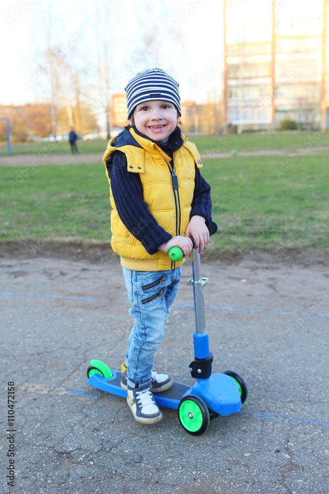 Cute little boy (3 years) with scooter outdoor Cute little boy (3 years) with scooter outdoor