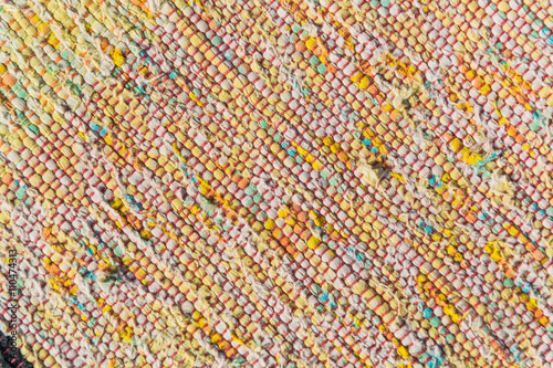 texture of woven cotton red  pink  white  yellow threads