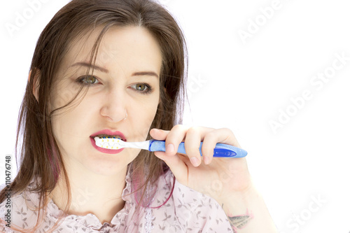 pretty lady brushing teeth
