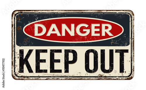 Danger keep out rusty metal sign