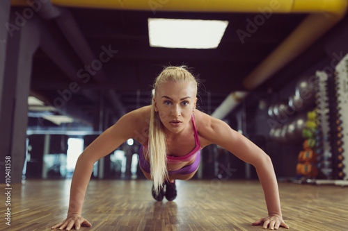 Strong and beautiful athletic woman training in the gym