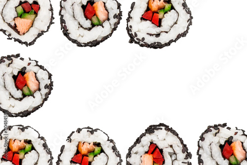 Uramaki sushi rolls covered with black sesame seeds isolated on white background.