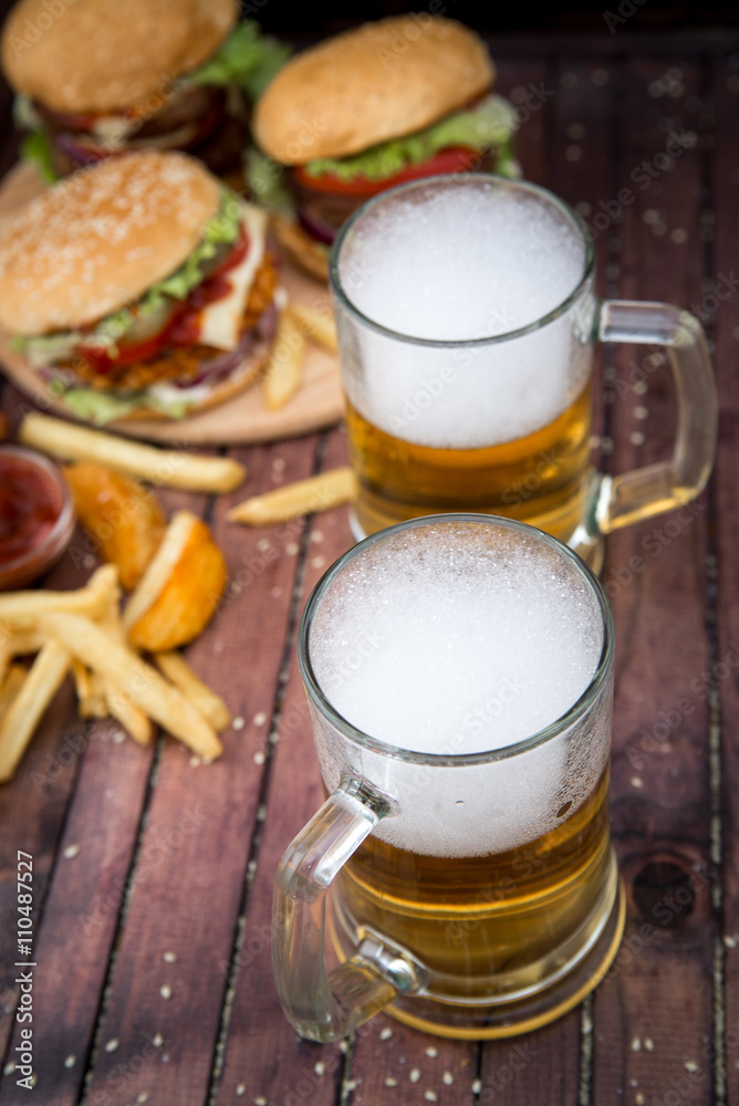Closeup of homemade burgers and beer