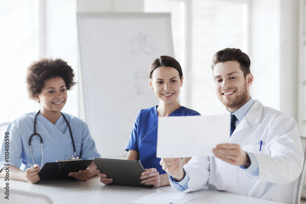 group of happy doctors meeting at hospital office group of happy doctors meeting at hospital office