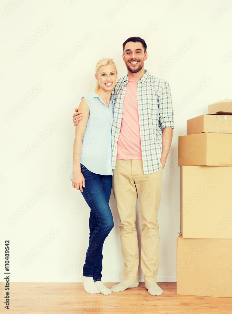 couple with cardboard boxes moving to new home couple with cardboard boxes moving to new home