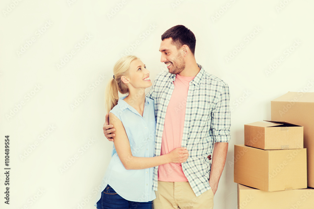 couple with cardboard boxes moving to new home