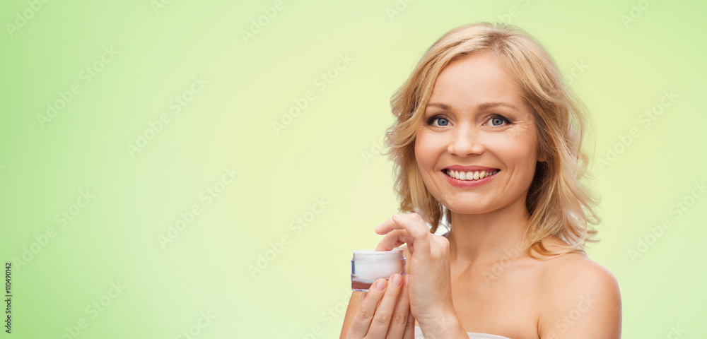 happy woman with cream jar happy woman with cream jar