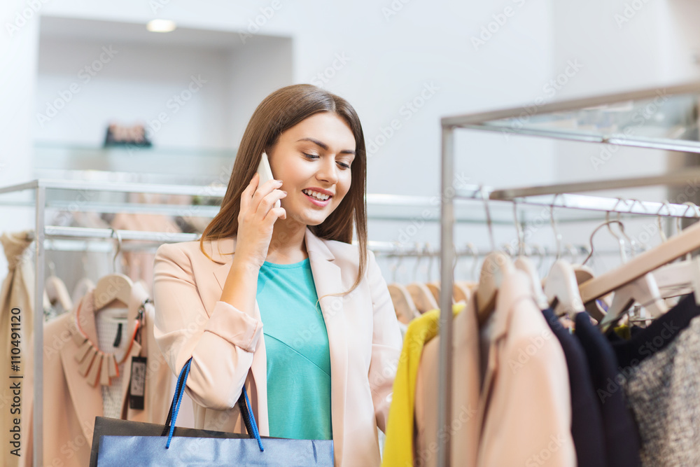 happy young woman choosing clothes in mall happy young woman choosing clothes in mall
