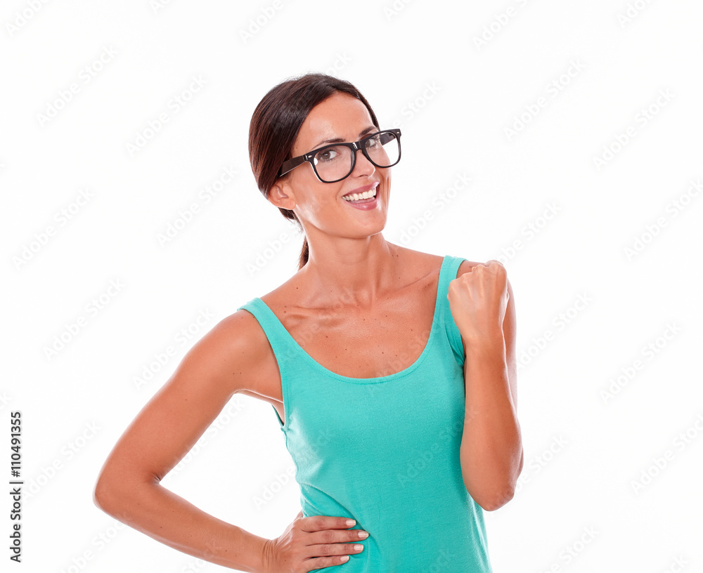 Celebrating adult woman smiling at camera Celebrating adult woman smiling at camera