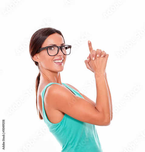 Adult woman pointing at copy space © pablocalvog