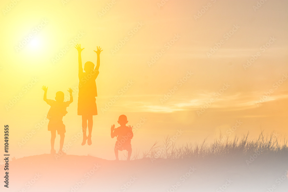 silhouette children playing happy time at sunset