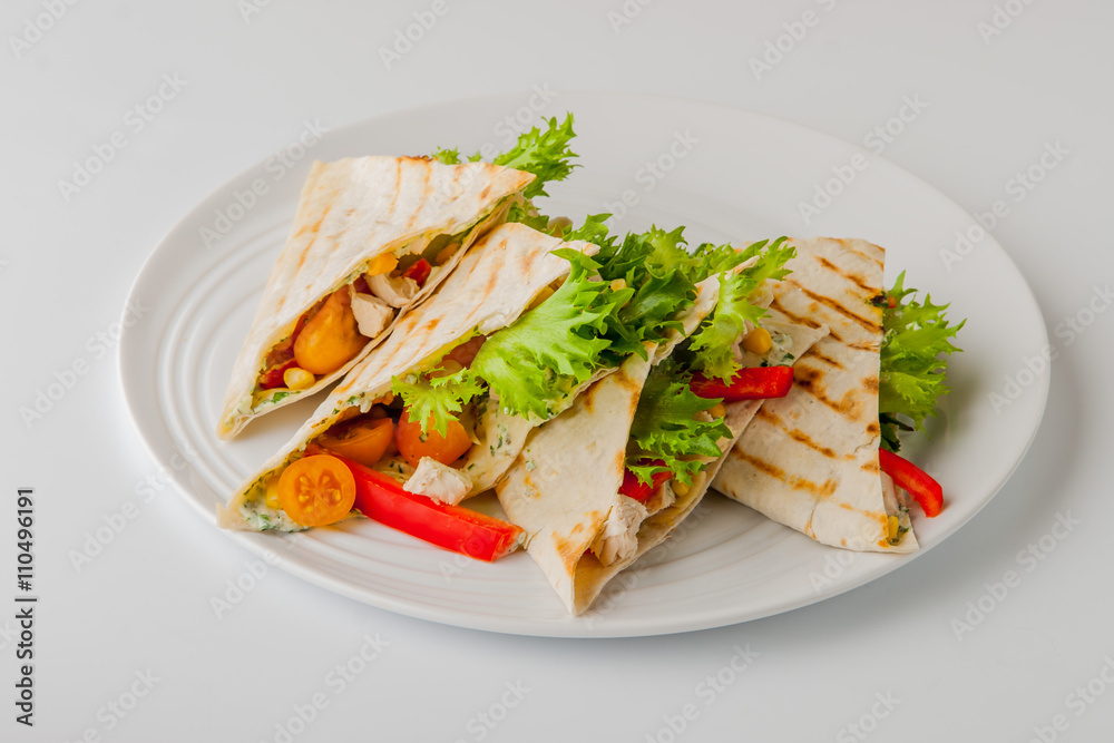Quesadilla with chicken and corn on a round plate Quesadilla with chicken and corn on a round plate