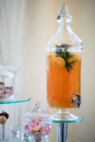 Fresh juice on wedding dessert table in restaurant