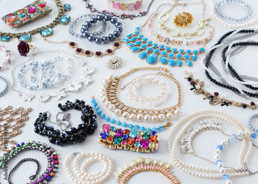 Fashion jewellery on white desk Fashion jewellery on white desk