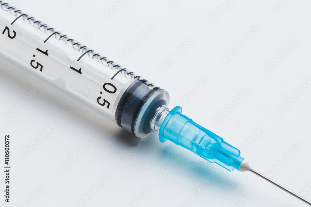 Disposable syringe in the row Disposable syringe in the row