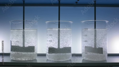 Flocculation experiment precipitation. Mixing reagent with laboratory stirrer photo