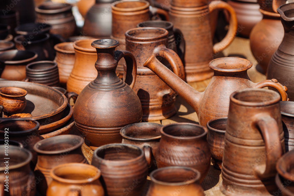 Lots of handmade clay pot, bowl and mug.