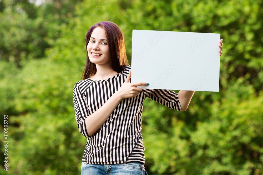 Woman holding blank banner