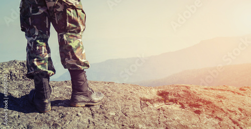 Canvas Print Soldier on the top of a mountain