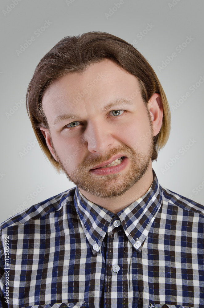 Young man grimace. Young man grimace.