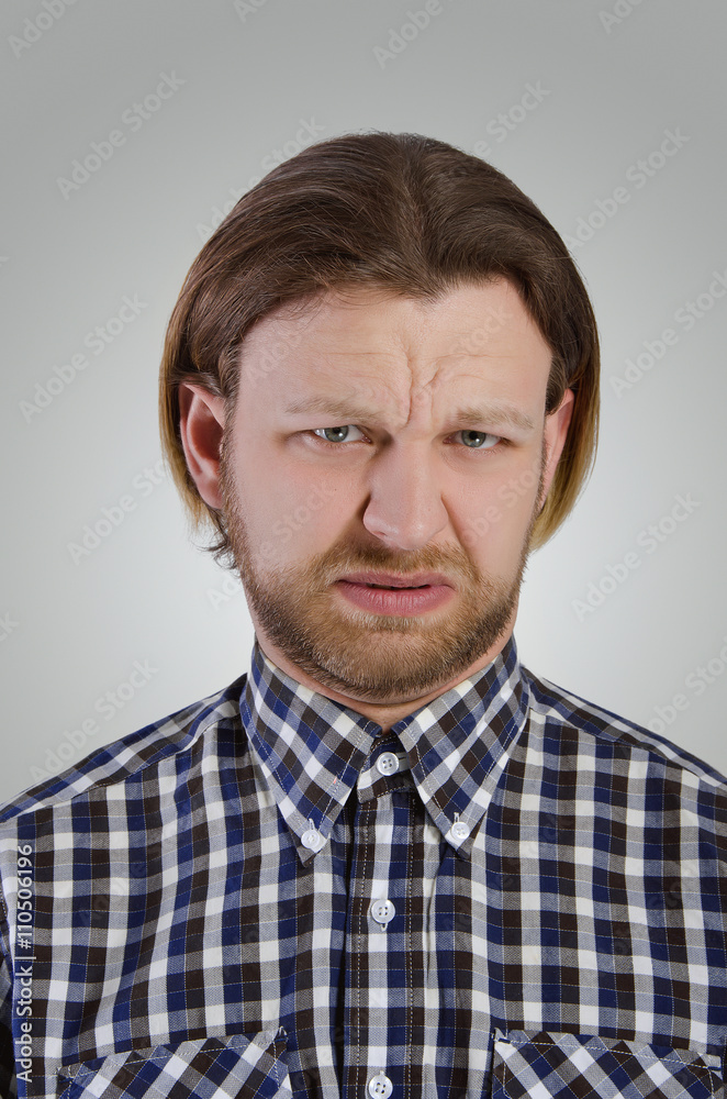 Obraz premium Young man grimace.