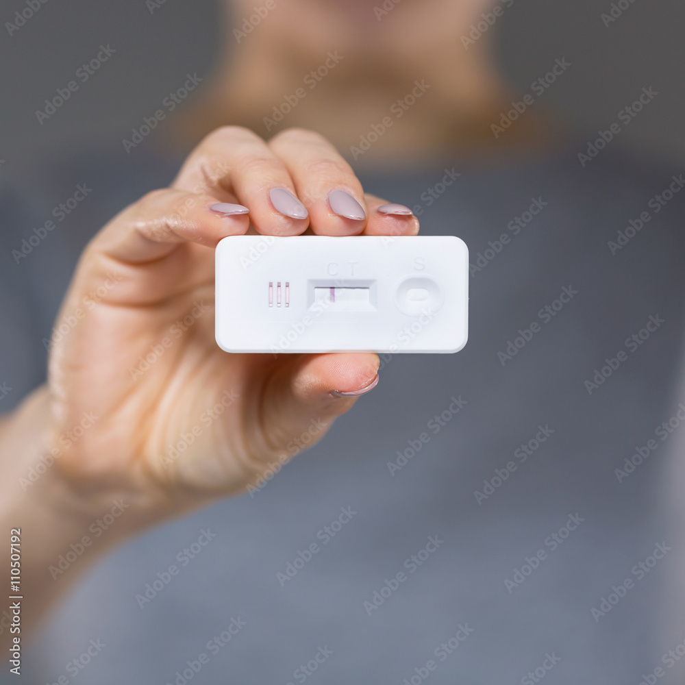 View of woman with negative pregnancy test View of woman with negative pregnancy test
