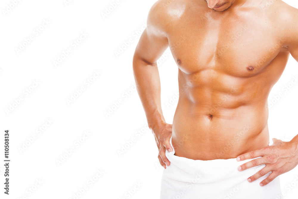Fit young man in towel, isolated on white background