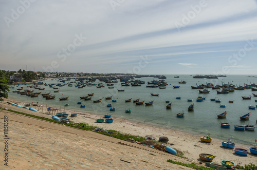 Fishing village and colorful fishing boats near Mui Ne at a sunny day. Vietnam © smoke666