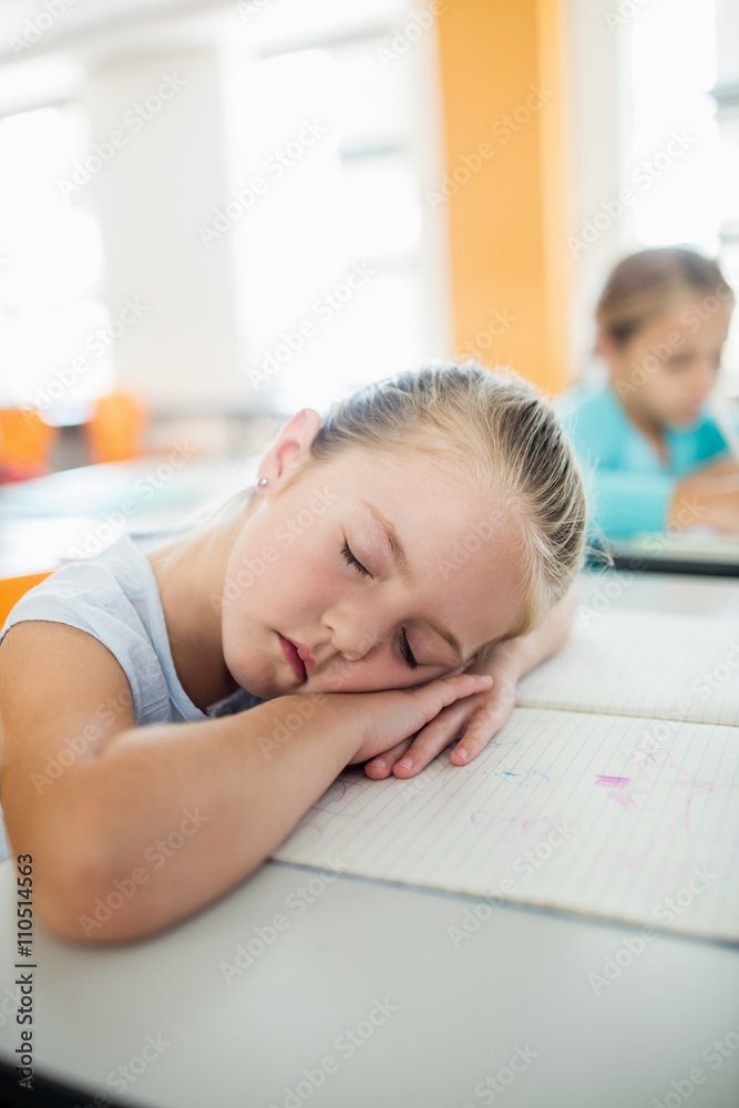 A cute girl falling asleep at desk A cute girl falling asleep at desk
