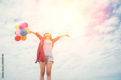 young beautiful woman holding balloon very happy on the fresh ai © Johnstocker