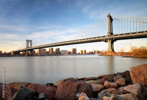 Manhattan Bridge over East River at sunset in New York City Manh